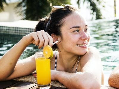 a-woman-in-a-pool-with-an-orange-juice.jpg a-woman-in-a-pool-with-an-orange-juice.jpg
